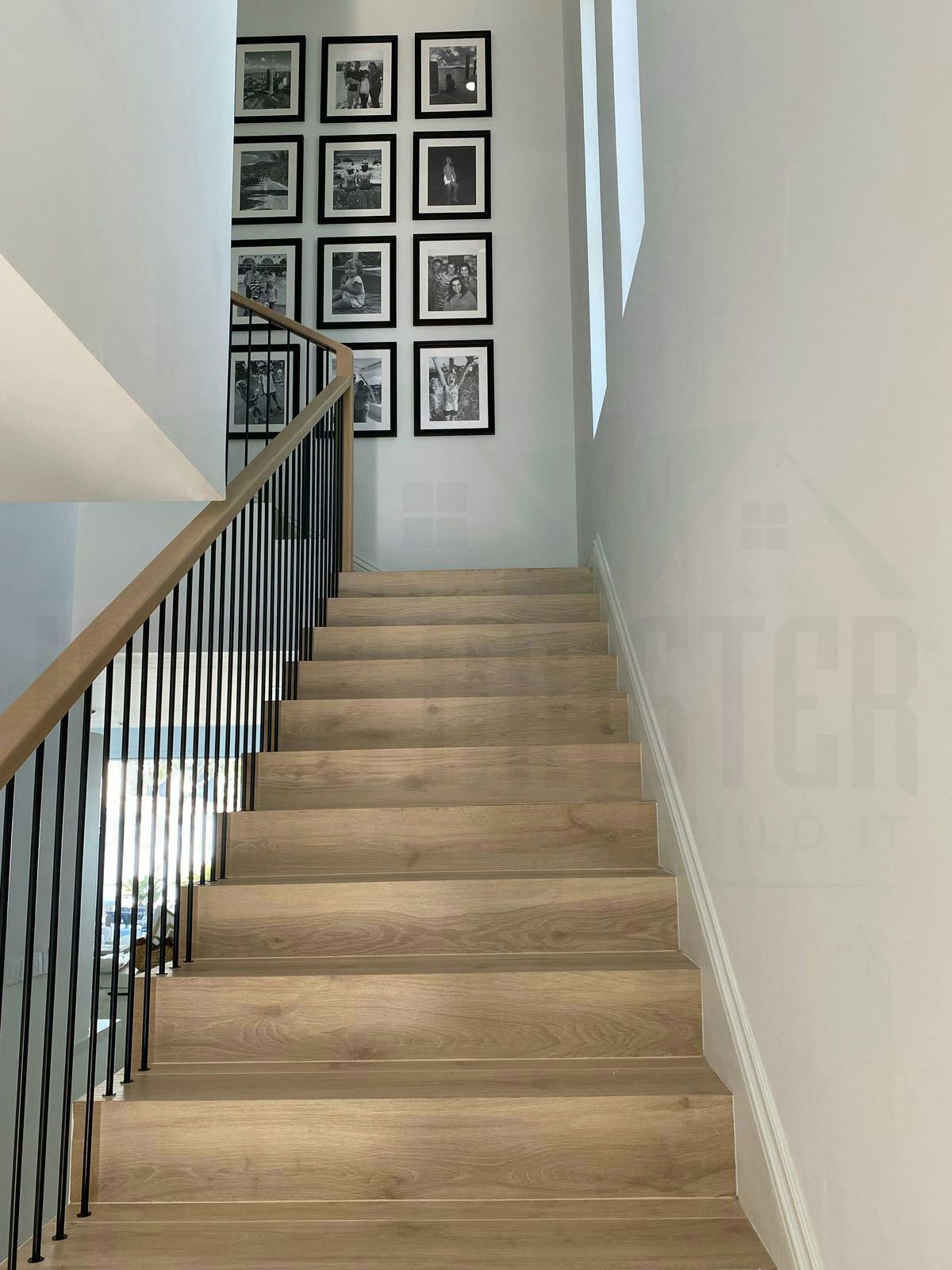 Modern glass staircase design with steel stair railing in a Dubai home