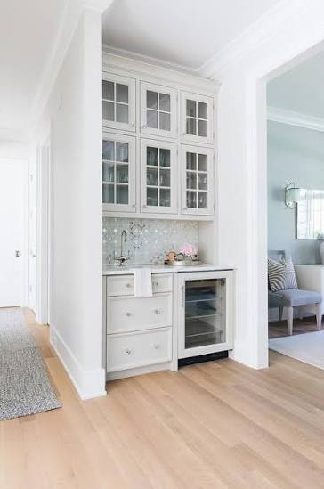 Custom wooden bar counter with shelving