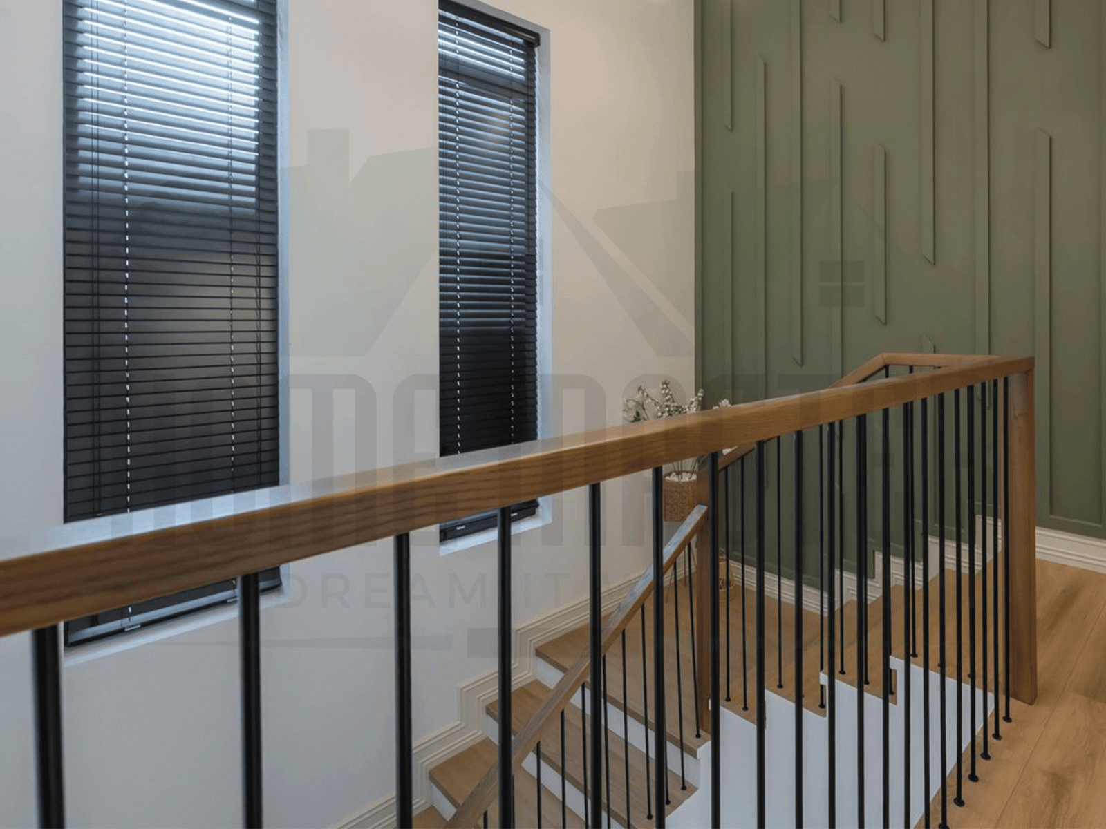 Modern staircase design with glass railing and wooden treads in a Dubai villa
